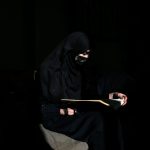 An Afghan woman, barred by the Taliban from attending university