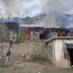 A civilian house in Kamdesh district of Nuristan province, Afghanistan, burns after being hit by artillery shelling reportedly carried out by Pakistani forces
