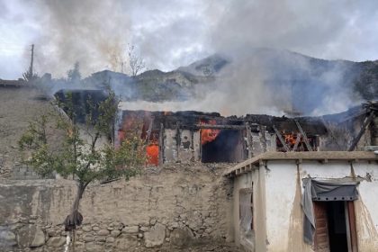 A civilian house in Kamdesh district of Nuristan province, Afghanistan, burns after being hit by artillery shelling reportedly carried out by Pakistani forces