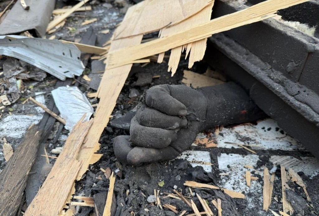 The body of a victim lies amid the debris inside the destroyed hospital building after the reported Pakistani airstrike in Kabul.